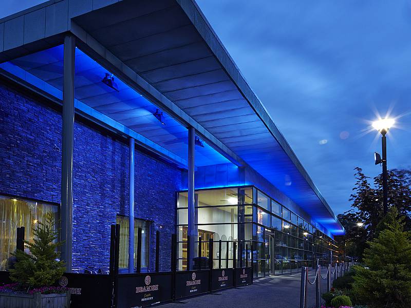 Modern Galway hotel exterior illuminated in the evening